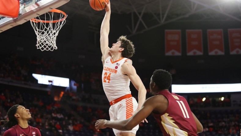 Feb 2, 2022; Clemson, South Carolina, USA; Clemson Tigers forward PJ Hall (24) dunks the ball during the first half against the Florida State Seminoles at Littlejohn Coliseum. Mandatory Credit: Dawson Powers-USA TODAY Sports