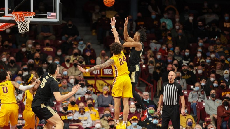 Feb 2, 2022; Minneapolis, Minnesota, USA; Purdue Boilermakers guard Jaden Ivey (23) shoots the ball against Minnesota Gophers guard Sean Sutherlin (24) during the first half at Williams Arena. Mandatory Credit: Matt Krohn-USA TODAY Sports