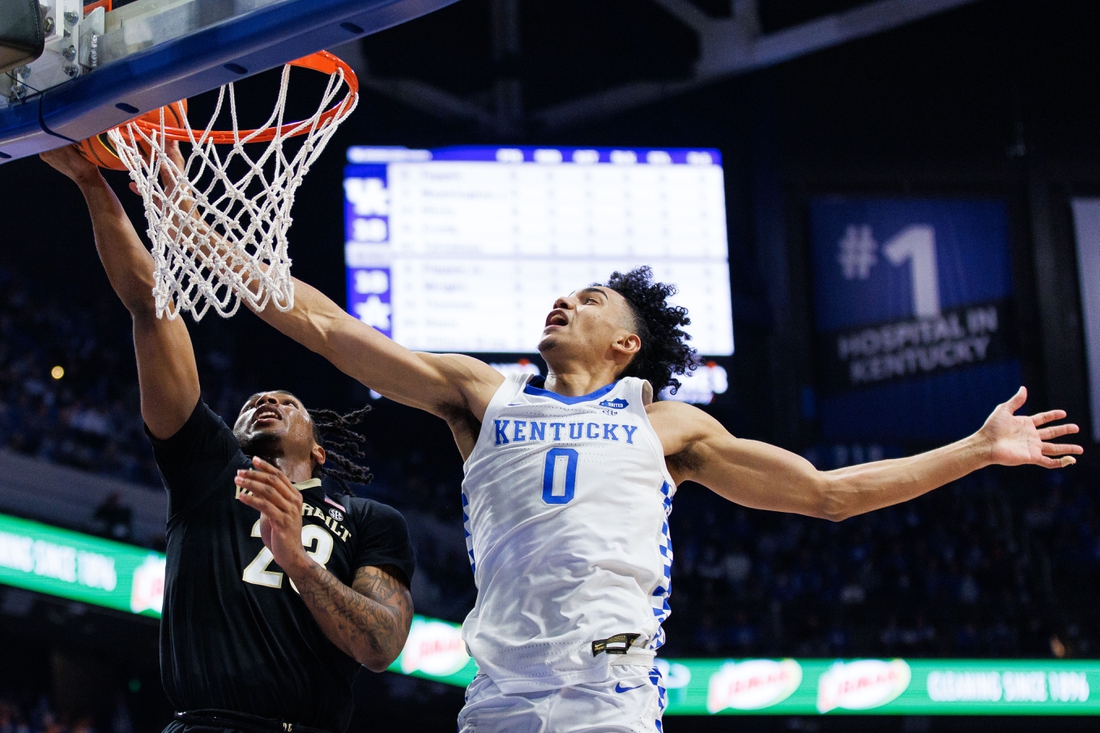 Feb 2, 2022; Lexington, Kentucky, USA; Kentucky Wildcats forward Jacob Toppin (0) blocks a shot by Vanderbilt Commodores guard Jamaine Mann (23) during the first half at Rupp Arena at Central Bank Center. Mandatory Credit: Jordan Prather-USA TODAY Sports