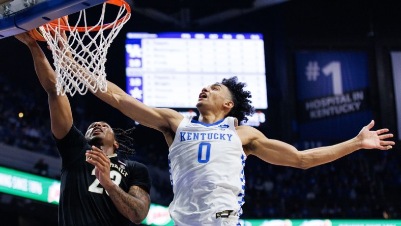 Feb 2, 2022; Lexington, Kentucky, USA; Kentucky Wildcats forward Jacob Toppin (0) blocks a shot by Vanderbilt Commodores guard Jamaine Mann (23) during the first half at Rupp Arena at Central Bank Center. Mandatory Credit: Jordan Prather-USA TODAY Sports