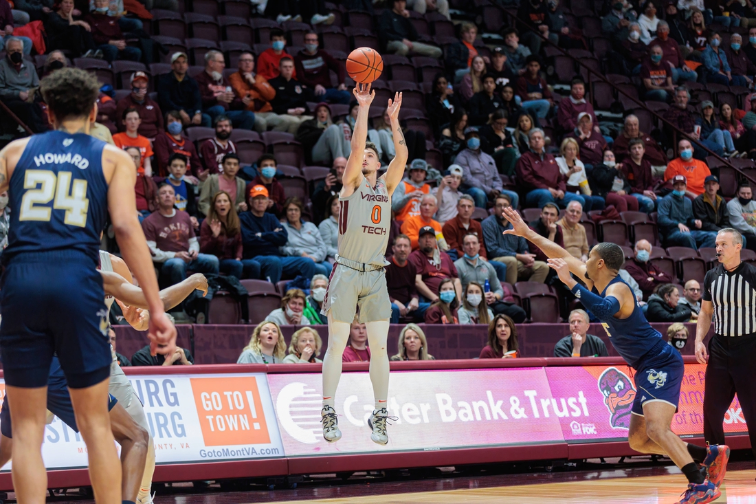 Feb 2, 2022; Blacksburg, Virginia, USA; Virginia Tech Hokies guard Hunter Cattoor (0) shoots against the Georgia Tech Yellow Jackets during the first half at Cassell Coliseum. Mandatory Credit: Ryan Hunt-USA TODAY Sports