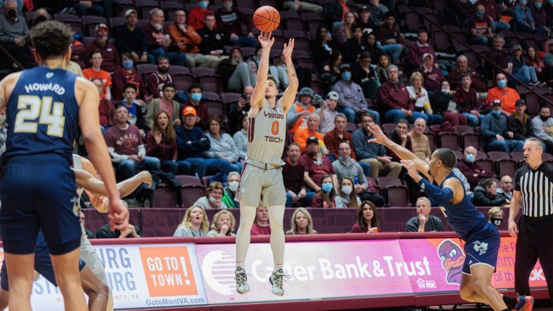 Feb 2, 2022; Blacksburg, Virginia, USA; Virginia Tech Hokies guard Hunter Cattoor (0) shoots against the Georgia Tech Yellow Jackets during the first half at Cassell Coliseum. Mandatory Credit: Ryan Hunt-USA TODAY Sports