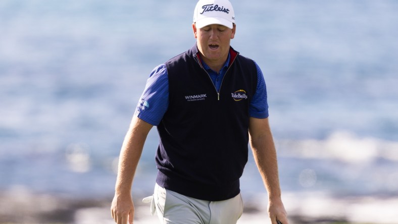 Feb 3, 2022; Pebble Beach, California, USA; Tom Hoge reacts after missing a birdie put on his final hole in the first round of the AT&T Pebble Beach Pro-Am golf tournament at Pebble Beach Golf Links. Mandatory Credit: Bill Streicher-USA TODAY Sports