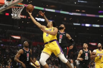 Feb 3, 2022; Los Angeles, California, USA; Los Angeles Lakers guard Talen Horton-Tucker (5) shoots a ball during the first quarter against the Los Angeles Clippers at Crypto.com Arena. Mandatory Credit: Kiyoshi Mio-USA TODAY Sports