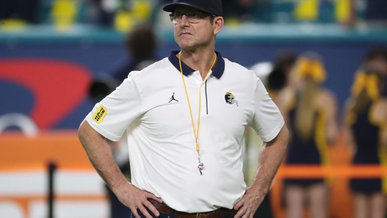 Michigan coach Jim Harbaugh watched his team warm up before the Orange Bowl against Georgia on Friday, Dec. 31, 2021, in Miami Gardens, Florida.

Capital One Orange Bowl