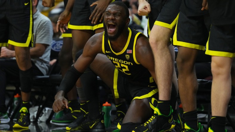 Feb 3, 2022; Boulder, Colorado, USA; Oregon Ducks center Franck Kepnang (22) reacts to a score in the second half against the Colorado Buffaloes at the CU Events Center. Mandatory Credit: Ron Chenoy-USA TODAY Sports