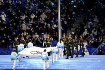 Feb 4, 2022; Beijing, CHINA;  The Olympic flag is raised during the Opening Ceremony of the Beijing 2022 Winter Olympic Games at Beijing National Stadium.  Mandatory Credit: Harrison Hill-USA TODAY Sports