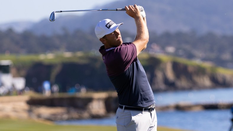 Feb 4, 2022; Pebble Beach, California, USA; Seamus Power plays his approach shot on the eighteenth hole during the second round of the AT&T Pebble Beach Pro-Am golf tournament at Pebble Beach Golf Links. Mandatory Credit: Bill Streicher-USA TODAY Sports