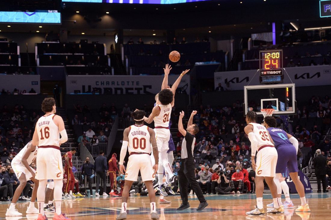 Feb 4, 2022; Charlotte, North Carolina, USA;  Cleveland Cavaliers center Jarrett Allen (31) and Charlotte Hornets center Mason Plumlee (24) tip off the game at the Spectrum Center. Mandatory Credit: Sam Sharpe-USA TODAY Sports