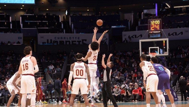 Feb 4, 2022; Charlotte, North Carolina, USA;  Cleveland Cavaliers center Jarrett Allen (31) and Charlotte Hornets center Mason Plumlee (24) tip off the game at the Spectrum Center. Mandatory Credit: Sam Sharpe-USA TODAY Sports