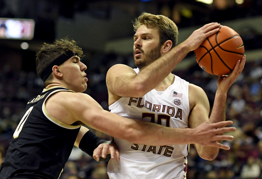 Feb 5, 2022; Tallahassee, Florida, USA; Florida State Seminoles forward Harrison Prieto (30) protects the ball from Wake Forest Deamon Deacons forward Jake Laravia (0) during the game at Donald L. Tucker Center. Mandatory Credit: Melina Myers-USA TODAY Sports