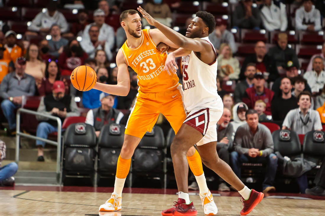 Feb 5, 2022; Columbia, South Carolina, USA; Tennessee Volunteers forward Uros Plavsic (33) passes around South Carolina Gamecocks forward Wildens Leveque (15) in the second half at Colonial Life Arena. Mandatory Credit: Jeff Blake-USA TODAY Sports