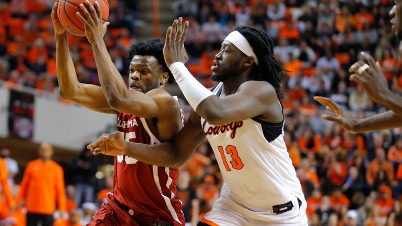 Oklahoma Sooners guard Elijah Harkless (55) tries to get past Oklahoma State Cowboys guard Bryce Thompson (1) during a Bedlam basketball game between the University of Oklahoma Sooners (OU) and the Oklahoma State University Cowboys (OSU) at Gallagher-Iba Arena in Stillwater, Saturday, Feb. 5, 2022. Oklahoma State won 64-55.

Bedlam Basketball