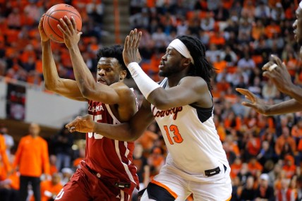 Oklahoma Sooners guard Elijah Harkless (55) tries to get past Oklahoma State Cowboys guard Bryce Thompson (1) during a Bedlam basketball game between the University of Oklahoma Sooners (OU) and the Oklahoma State University Cowboys (OSU) at Gallagher-Iba Arena in Stillwater, Saturday, Feb. 5, 2022. Oklahoma State won 64-55.

Bedlam Basketball