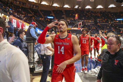 Feb 5, 2022; Morgantown, West Virginia, USA; Texas Tech Red Raiders forward Marcus Santos-Silva (14) celebrates after defeating the West Virginia Mountaineers at WVU Coliseum. Mandatory Credit: Ben Queen-USA TODAY Sports