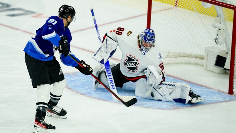 Feb 5, 2022; Las Vegas, Nevada, USA; Atlantic Division goalie Andrei Vasilevskiy (88) of the Tampa Bay Lightning makes a save in net against Central Division forward Nazem Kadri (91) of the Colorado Avalanche during the 2022 NHL All-Star Game at T-Mobile Arena. Mandatory Credit: Lucas Peltier-USA TODAY Sports