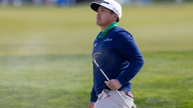 Feb 5, 2022; Pebble Beach, California, USA; Kurt Kitayama plays a shot from the bunker on the 5th hole during the third round of the AT&T Pebble Beach Pro-Am golf tournament at Monterey Peninsula Country Club - Shore Course. Mandatory Credit: Bill Streicher-USA TODAY Sports