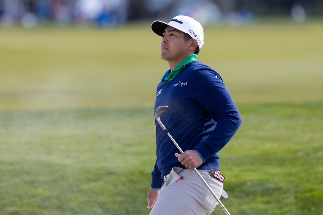 Feb 5, 2022; Pebble Beach, California, USA; Kurt Kitayama plays a shot from the bunker on the 5th hole during the third round of the AT&T Pebble Beach Pro-Am golf tournament at Monterey Peninsula Country Club - Shore Course. Mandatory Credit: Bill Streicher-USA TODAY Sports