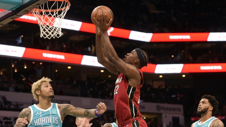 Feb 5, 2022; Charlotte, North Carolina, USA;  Miami Heat forward Jimmy Butler (22) scores against the Charlotte Hornets during the first half at the Spectrum Center. Mandatory Credit: Sam Sharpe-USA TODAY Sports