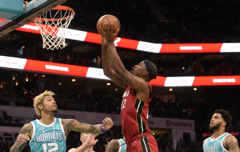 Feb 5, 2022; Charlotte, North Carolina, USA;  Miami Heat forward Jimmy Butler (22) scores against the Charlotte Hornets during the first half at the Spectrum Center. Mandatory Credit: Sam Sharpe-USA TODAY Sports
