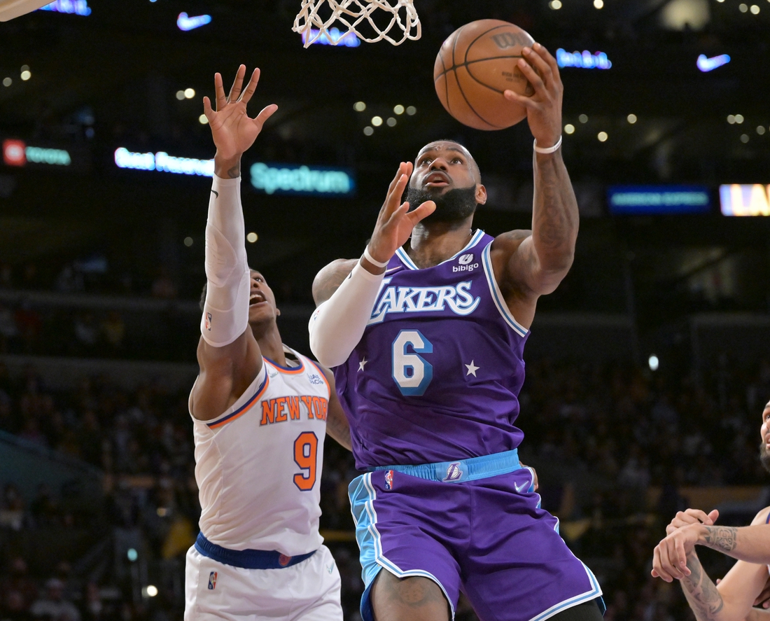 Feb 5, 2022; Los Angeles, California, USA;   Los Angeles Lakers forward LeBron James (6) goes up for a basket past New York Knicks guard RJ Barrett (9) in the second half at Crypto.com Arena. Mandatory Credit: Jayne Kamin-Oncea-USA TODAY Sports