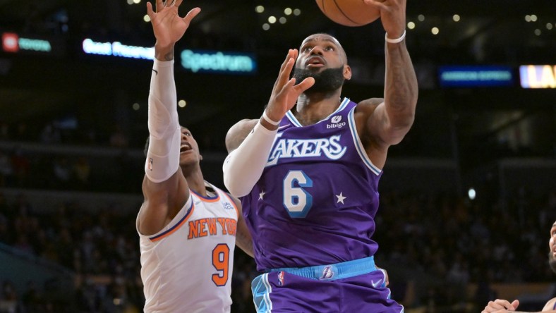 Feb 5, 2022; Los Angeles, California, USA;   Los Angeles Lakers forward LeBron James (6) goes up for a basket past New York Knicks guard RJ Barrett (9) in the second half at Crypto.com Arena. Mandatory Credit: Jayne Kamin-Oncea-USA TODAY Sports