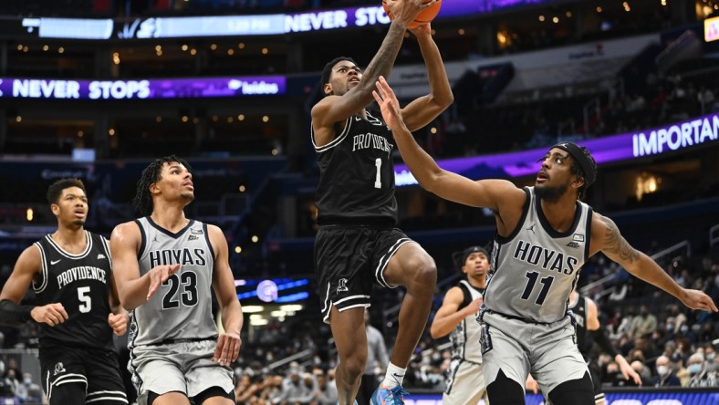 Feb 6, 2022; Washington, District of Columbia, USA; Providence Friars guard Al Durham (1) shoots as Georgetown Hoyas forward Collin Holloway (23) and guard Kaiden Rice (11) look on during the second half at Capital One Arena. Mandatory Credit: Brad Mills-USA TODAY Sports