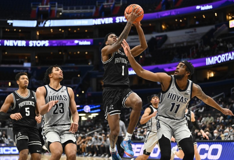 Feb 6, 2022; Washington, District of Columbia, USA; Providence Friars guard Al Durham (1) shoots as Georgetown Hoyas forward Collin Holloway (23) and guard Kaiden Rice (11) look on during the second half at Capital One Arena. Mandatory Credit: Brad Mills-USA TODAY Sports