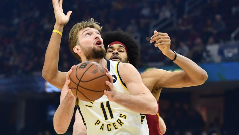 Feb 6, 2022; Cleveland, Ohio, USA; Indiana Pacers forward Domantas Sabonis (11) drives to the basket against Cleveland Cavaliers center Jarrett Allen (31) during the first quarter at Rocket Mortgage FieldHouse. Mandatory Credit: Ken Blaze-USA TODAY Sports