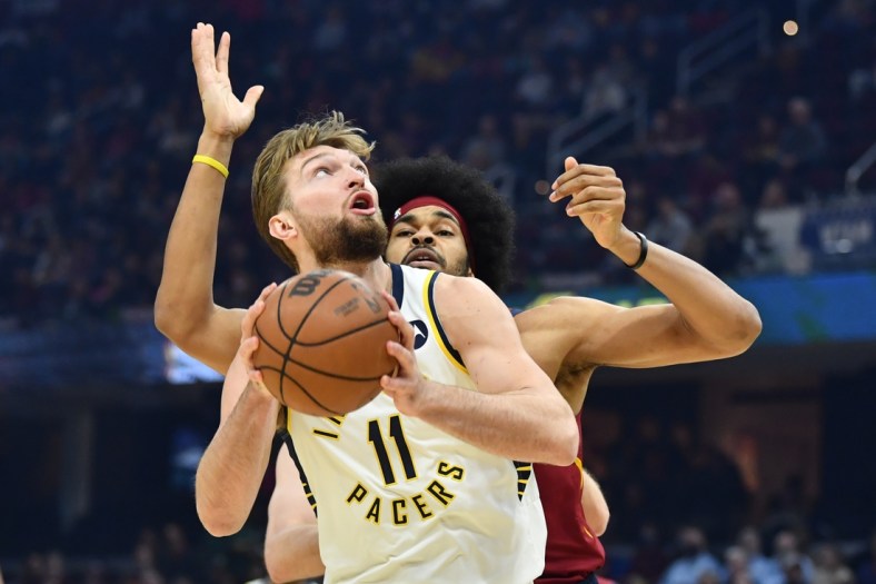 Feb 6, 2022; Cleveland, Ohio, USA; Indiana Pacers forward Domantas Sabonis (11) drives to the basket against Cleveland Cavaliers center Jarrett Allen (31) during the first quarter at Rocket Mortgage FieldHouse. Mandatory Credit: Ken Blaze-USA TODAY Sports