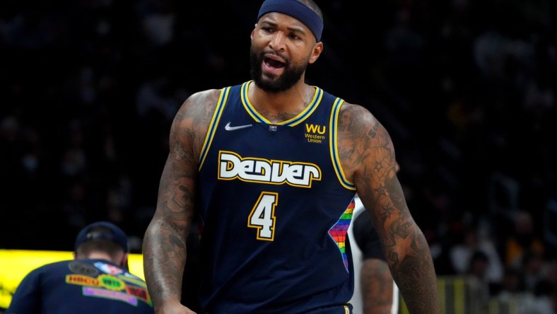 Feb 6, 2022; Denver, Colorado, USA; Denver Nuggets center DeMarcus Cousins (4) reacts during the second quarter against the Brooklyn Nets at Ball Arena. Mandatory Credit: Ron Chenoy-USA TODAY Sports