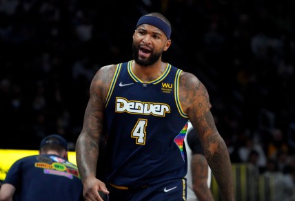 Feb 6, 2022; Denver, Colorado, USA; Denver Nuggets center DeMarcus Cousins (4) reacts during the second quarter against the Brooklyn Nets at Ball Arena. Mandatory Credit: Ron Chenoy-USA TODAY Sports