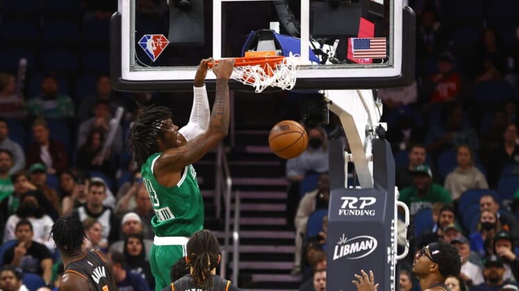 Feb 6, 2022; Orlando, Florida, USA; Boston Celtics center Robert Williams III (44) dunks against the Orlando Magic during the first quarter at Amway Center. Mandatory Credit: Kim Klement-USA TODAY Sports