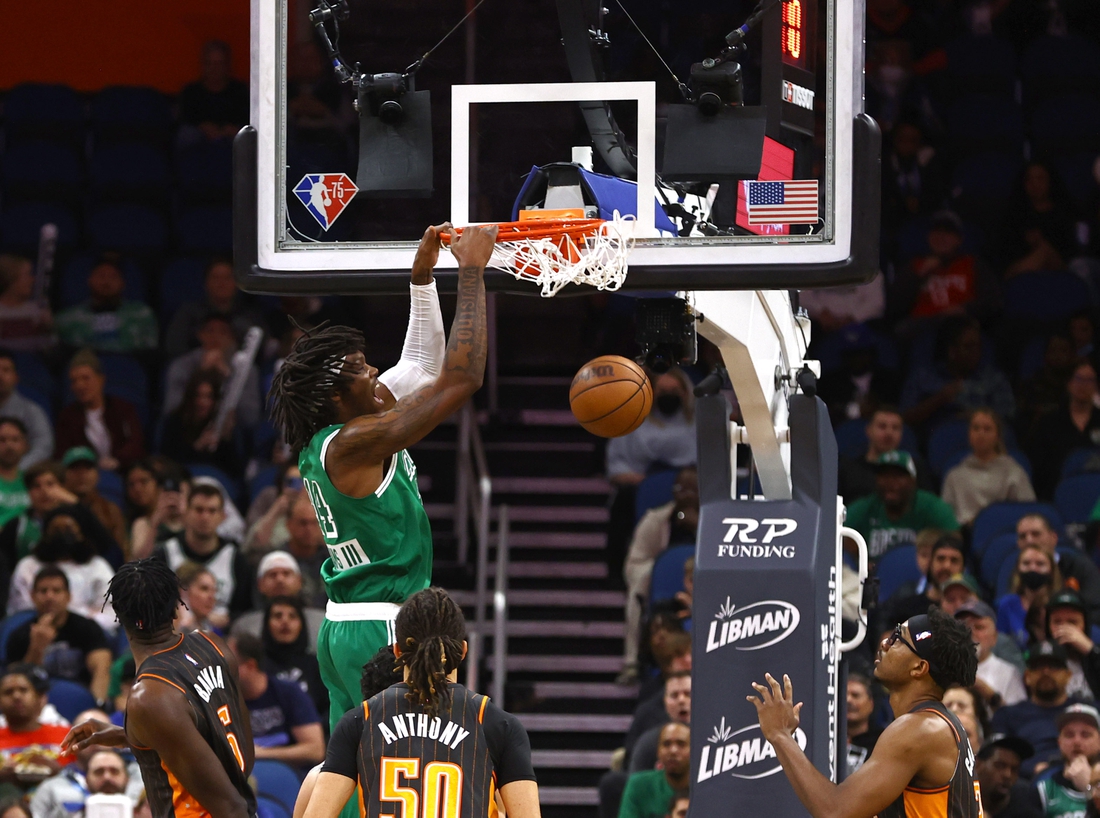 Feb 6, 2022; Orlando, Florida, USA; Boston Celtics center Robert Williams III (44) dunks against the Orlando Magic during the first quarter at Amway Center. Mandatory Credit: Kim Klement-USA TODAY Sports