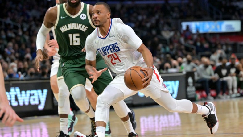 Feb 6, 2022; Los Angeles, California, USA;  Los Angeles Clippers forward Norman Powell (24) drives to the basket past Milwaukee Bucks guard Jeff Dowtin (15) in the second half at Crypto.com Arena. Mandatory Credit: Jayne Kamin-Oncea-USA TODAY Sports