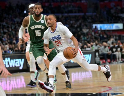 Feb 6, 2022; Los Angeles, California, USA;  Los Angeles Clippers forward Norman Powell (24) drives to the basket past Milwaukee Bucks guard Jeff Dowtin (15) in the second half at Crypto.com Arena. Mandatory Credit: Jayne Kamin-Oncea-USA TODAY Sports