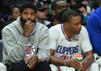 Feb 6, 2022; Los Angeles, California, USA;    Los Angeles Clippers guard Paul George (13) sits on the bench next to Los Angeles Clippers forward Norman Powell (24) in the second half against the Milwaukee Bucks at Crypto.com Arena. Mandatory Credit: Jayne Kamin-Oncea-USA TODAY Sports