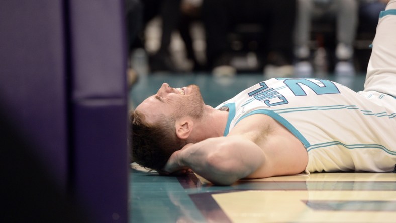 Feb 7, 2022; Charlotte, North Carolina, USA;  Charlotte Hornets guard forward Gordon Hayward (20) lays injured after a hard fall during the first half against the Toronto Raptors at the Spectrum Center. Mandatory Credit: Sam Sharpe-USA TODAY Sports