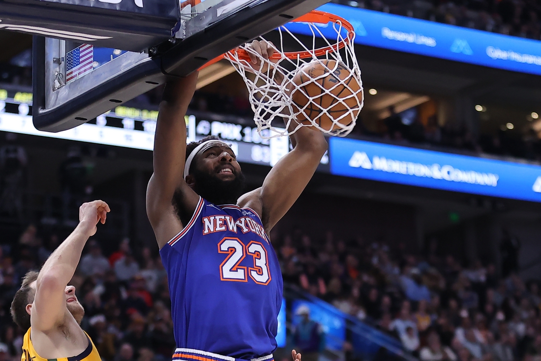 Feb 7, 2022; Salt Lake City, Utah, USA; New York Knicks center Mitchell Robinson (23) dunks the ball in the second quarter against the Utah Jazz at Vivint Arena. Mandatory Credit: Rob Gray-USA TODAY Sports