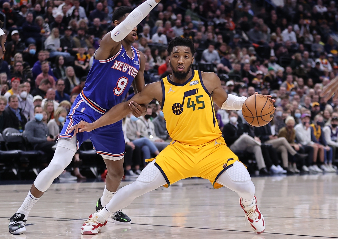 Feb 7, 2022; Salt Lake City, Utah, USA; Utah Jazz guard Donovan Mitchell (45) steps back to take a shot defended by New York Knicks guard RJ Barrett (9) in the third quarter at Vivint Arena. Mandatory Credit: Rob Gray-USA TODAY Sports