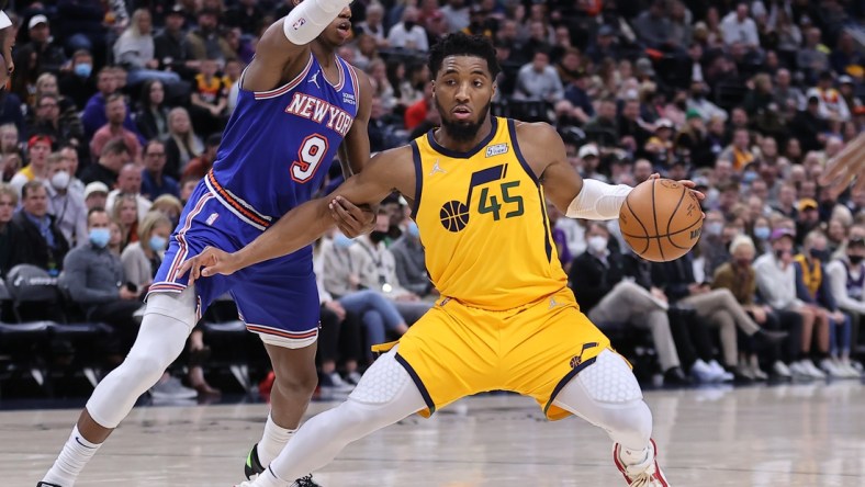 Feb 7, 2022; Salt Lake City, Utah, USA; Utah Jazz guard Donovan Mitchell (45) steps back to take a shot defended by New York Knicks guard RJ Barrett (9) in the third quarter at Vivint Arena. Mandatory Credit: Rob Gray-USA TODAY Sports