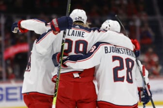 Feb 8, 2022; Washington, District of Columbia, USA; Columbus Blue Jackets left wing Patrik Laine (29) celebrates with teammates after scoring a goal against the Washington Capitals during the second period at Capital One Arena. Mandatory Credit: Geoff Burke-USA TODAY Sports