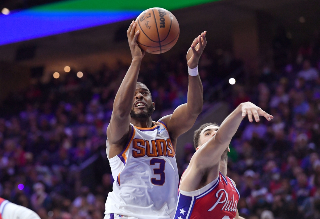 Feb 8, 2022; Philadelphia, Pennsylvania, USA; Phoenix Suns guard Chris Paul (3) drives to the basket past Philadelphia 76ers forward Georges Niang (20) during the fourth quarter at Wells Fargo Center. Mandatory Credit: Eric Hartline-USA TODAY Sports