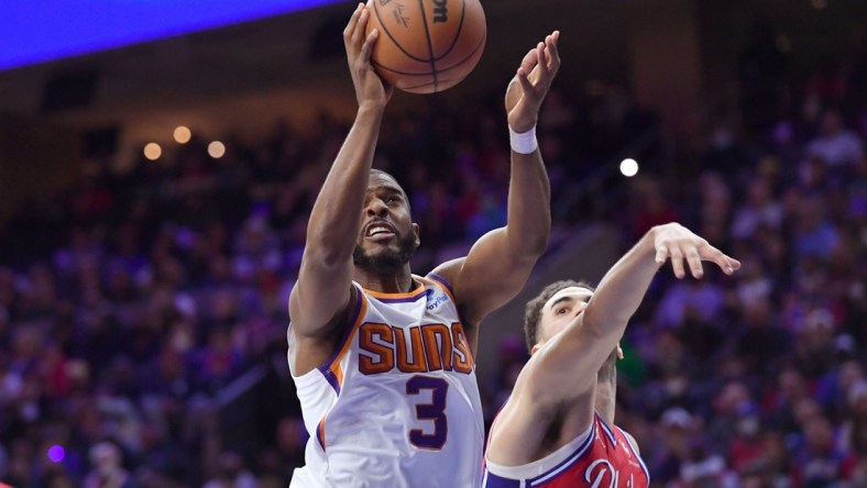 Feb 8, 2022; Philadelphia, Pennsylvania, USA; Phoenix Suns guard Chris Paul (3) drives to the basket past Philadelphia 76ers forward Georges Niang (20) during the fourth quarter at Wells Fargo Center. Mandatory Credit: Eric Hartline-USA TODAY Sports