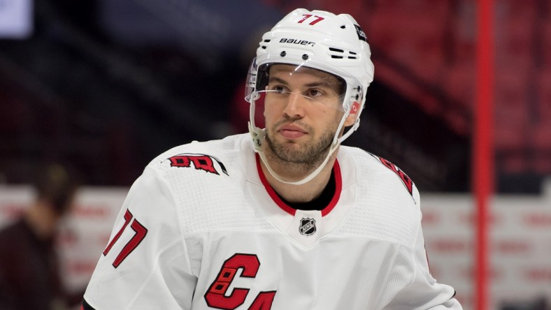 Feb 8, 2022; Ottawa, Ontario, CAN; Carolina Hurricanes defenseman Tony DeAngelo (77) skates during a break in the second period against the Ottawa Senators at the Canadian Tire Centre. Mandatory Credit: Marc DesRosiers-USA TODAY Sports