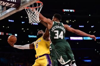 Feb 8, 2022; Los Angeles, California, USA; Los Angeles Lakers forward LeBron James (6) moves to the basket against Milwaukee Bucks forward Giannis Antetokounmpo (34) during the first half at Crypto.com Arena. Mandatory Credit: Gary A. Vasquez-USA TODAY Sports