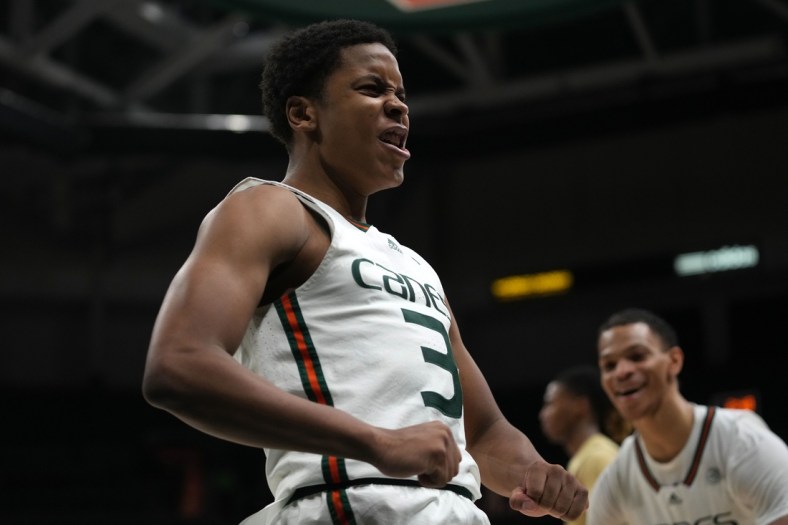 Feb 9, 2022; Coral Gables, Florida, USA; Miami Hurricanes guard Charlie Moore (3) reacts after making a basket against the Georgia Tech Yellow Jackets during the second half at Watsco Center. Mandatory Credit: Jasen Vinlove-USA TODAY Sports