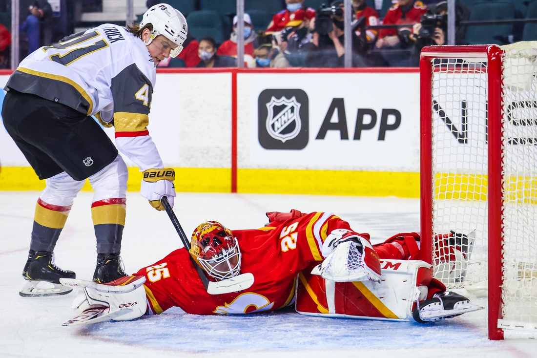 Feb 9, 2022; Calgary, Alberta, CAN; Calgary Flames goaltender Jacob Markstrom (25) makes a save against Vegas Golden Knights center Nolan Patrick (41) during the second period at Scotiabank Saddledome. Mandatory Credit: Sergei Belski-USA TODAY Sports