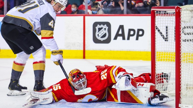 Feb 9, 2022; Calgary, Alberta, CAN; Calgary Flames goaltender Jacob Markstrom (25) makes a save against Vegas Golden Knights center Nolan Patrick (41) during the second period at Scotiabank Saddledome. Mandatory Credit: Sergei Belski-USA TODAY Sports