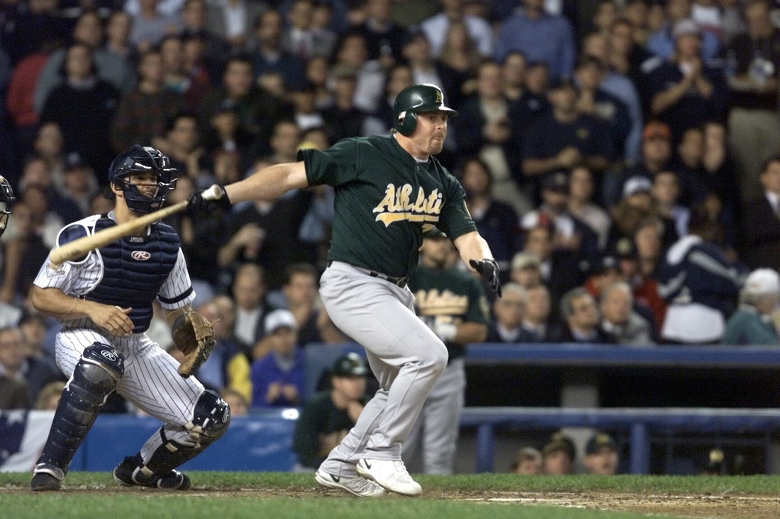 Oakland Athletics Jeremy Giambi hits a run scoring single in the top of the second inning during the AL Division Series game 5 at Yankee Stadium on Oct. 15, 2001. Giambi, the former major league outfielder and first baseman, died Wednesday, Feb. 9, 2022, at his parents' home in Southern California, police said. He was 47.

Xxx Rd Alds 5 S Bba Usa Ny